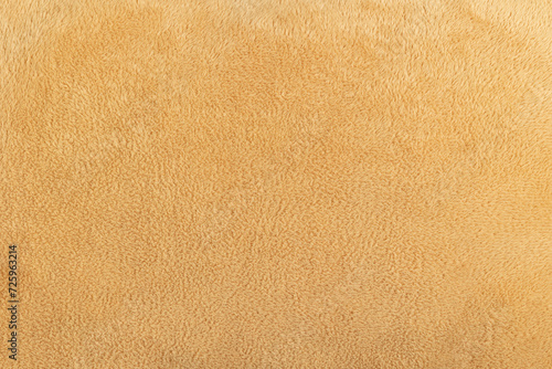 Texture of beige terry fabric. Terry background.