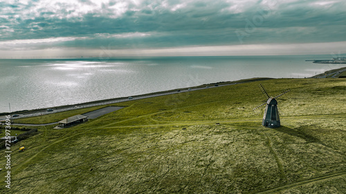 Aerial view if an old windmill on the top of the cliff by the sea, Rottingdean, Brighton, East Sussex, UK