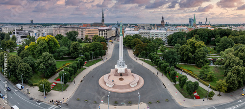 Beautiful sunrise view over Riga by the statue of liberty - Milda in Latvia. The monument of freedom.