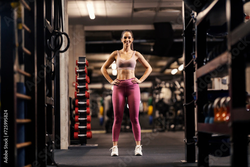 Portrait of a fit sportswoman posing in a gym.