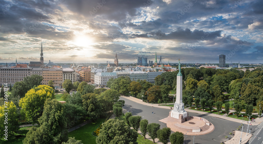 Beautiful sunrise view over Riga by the statue of liberty - Milda in Latvia. The monument of freedom.