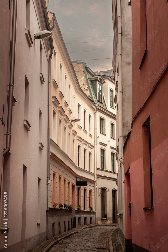 Panorama of a medieval narrow street in Riga, a pedestrian cobblestone street of Vecriga Vecpilseta, the historical center old town of Latvian capital city.