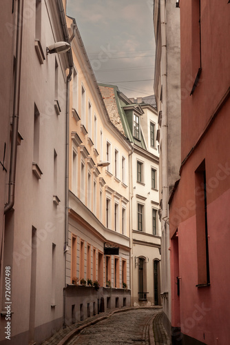 Panorama of a medieval narrow street in Riga, a pedestrian cobblestone street of Vecriga Vecpilseta, the historical center old town of Latvian capital city.