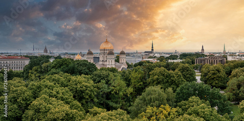The Nativity of Christ Cathedral in Riga, Latvia. Byzantine-styled Orthodox cathedral, the largest in the Baltic region, with golden colored dome, polished gilded cupolas gleaming through the trees