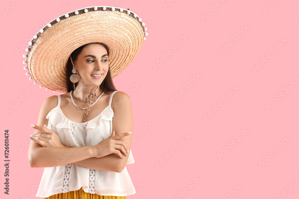 Beautiful woman in sombrero hat on pink background Beautiful woman in sombrero hat on pink background