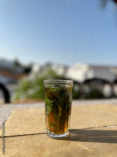 Cup of green tea with mint in chefchaouen blue city medina in morocco. © Zizo