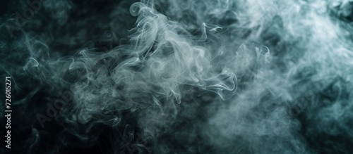 Selective focus and toning create a cloud of smoke on a black background.