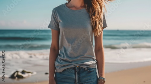 bohemian woman wearing a blank heather gray bella canvas 3001 tshirt mockup, backgound walking on the beach, 