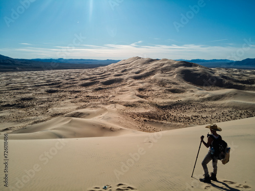 hiker crossing the mohave desert  photo