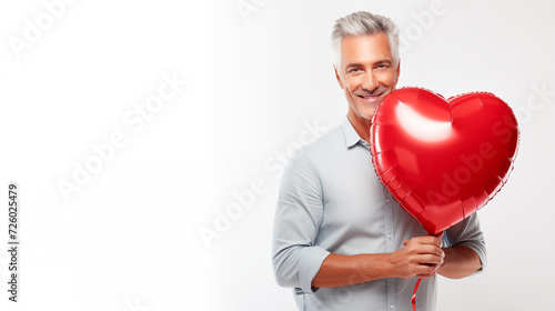 Valentine's Day Attractive Man Smiling and Holding A Big Red Balloon © Mircea Maties