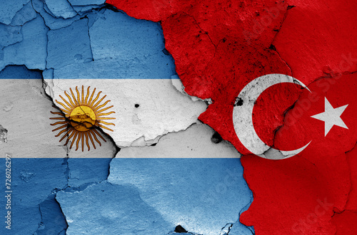 flags of Argentina and Turkey painted on cracked wall