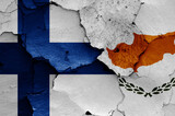 flags of Finland and Cyprus painted on cracked wall