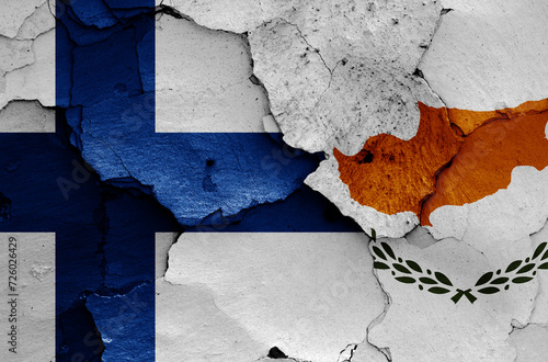 flags of Finland and Cyprus  painted on cracked wall