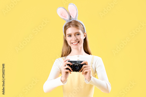 Young woman in bunny ears w...