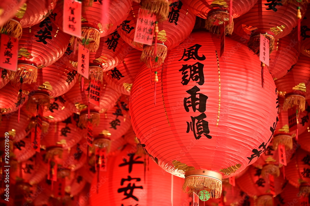 Naklejka premium Taipei, Taiwan - Feb 01, 2024: The worship lanterns in the temple to pray for blessing. The lantern in the picture says