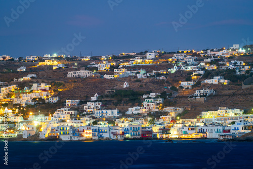 Mykonos village illuminated at dusk on Mykonos island. Greece