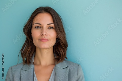 Confident Businesswoman with Shoulder Length Brown Hair Wearing a Blazer