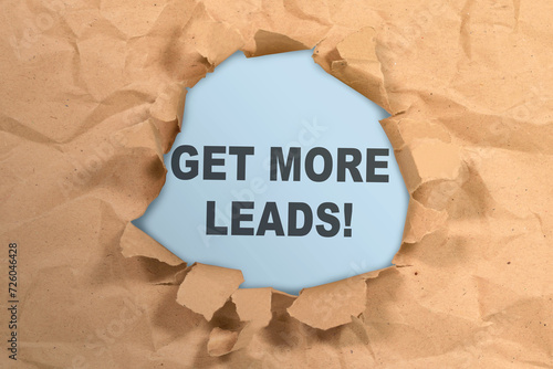 Ripped paper with get more leads text photo