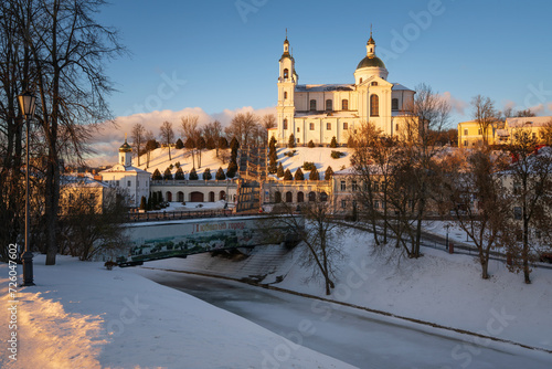 View of the Assumption Mountain, the Holy Spirit Monastery and the Holy Assumption Cathedral on the bank of the Vitba river on a sunny winter day, Vitebsk, Belarus