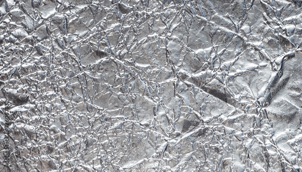 Shiny leaf silver foil paper background texture; colorful reflecting creative image concept Shiny leaf silver foil paper background texture; colorful reflecting creative image concept