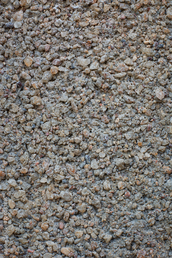 close-up macro view of sand and cement mix grainy concrete wall surface, concrete mixture made of too much sand or too little cement, abstract background or backdrop texture close-up macro view of sand and cement mix grainy concrete wall surface, concrete mixture made of too much sand or too little cement, abstract background or backdrop texture
