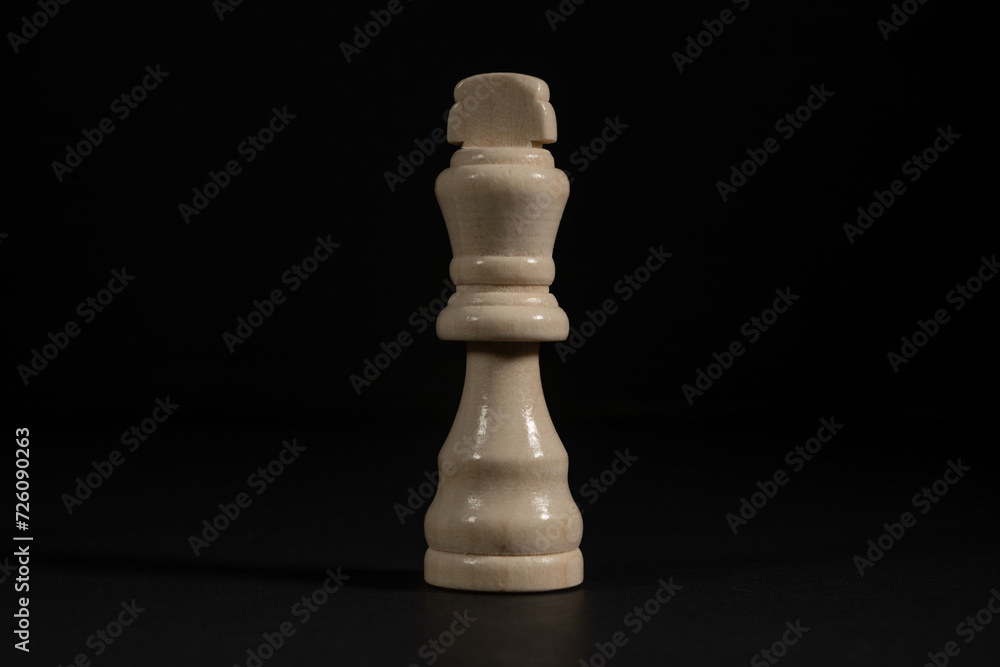 Isolated image of white king chess piece on black background. Isolated image of white king chess piece on black background.