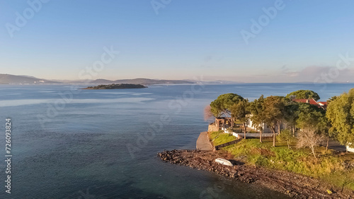 seaside town on a gulf at sunset time and colors aerial photos