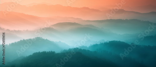 Serene Morning in Misty Mountains: A Breathtaking Landscape Bathed in Sunrise Hues with Layers of Fog Enshrouding the Hills