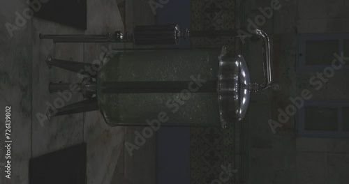 Clear glass water tank container with bubbles. Industrial mineral filtration sistem station plant.  photo