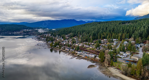 Residential Homes on the Ocean Shore with mountains in background.