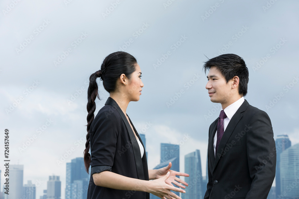 Portrait of asian business people talking outside Portrait of asian business people talking outside