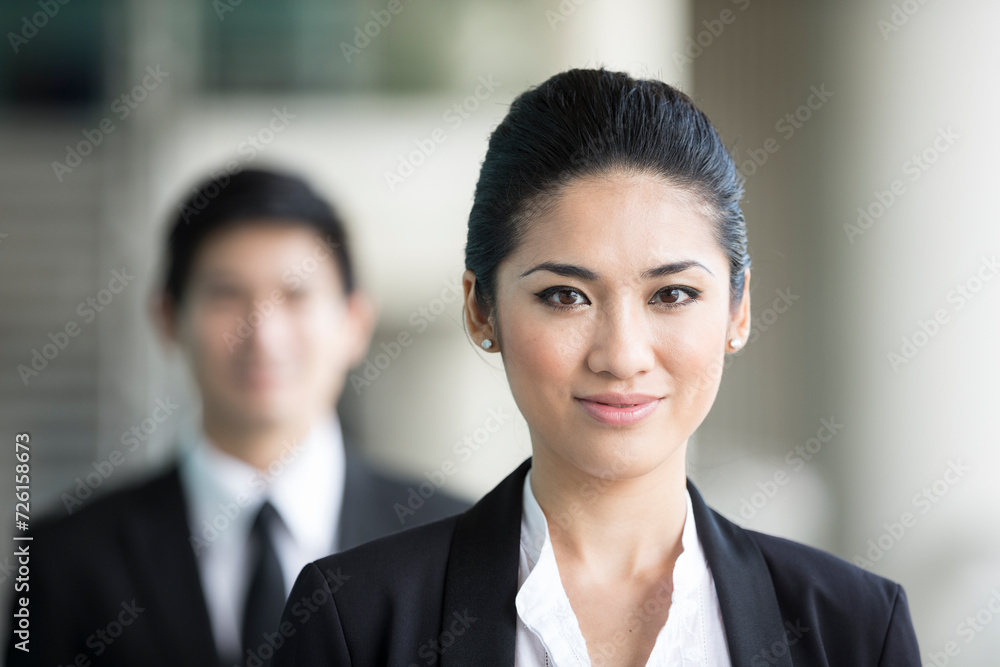 Asian businesswoman with a happy expression. Asian businesswoman with a happy expression.