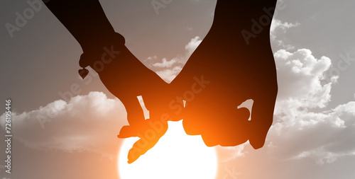 Silhouette of couple's arms holding hands at sunset. Celebrate Valentines Day. 3d illustration