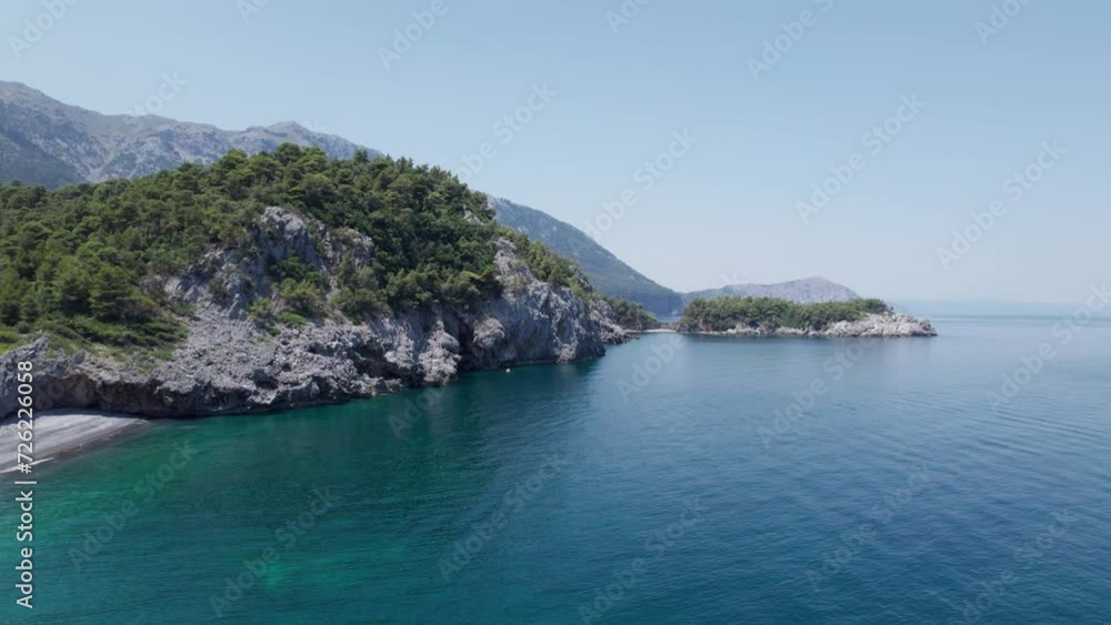 Aerial of Evoia Island drone fly above clear sea water during a sunny day of summer greek europe Aerial of Evoia Island drone fly above clear sea water during a sunny day of summer greek europe