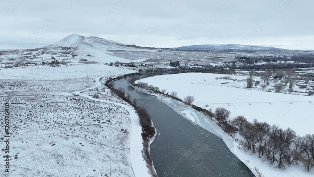 Drone shot of the Yakima River running through rural Washington during winter. Drone shot of the Yakima River running through rural Washington during winter.