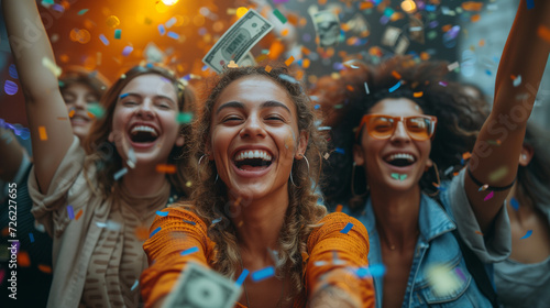 A group of diversity business people enjoy a celebration, with confetti and banknotes in the air and money flying around, sharing a moment of successful