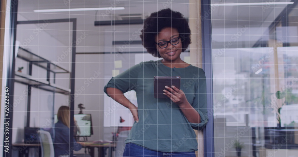 Fototapeta premium Image of data processing over african american businesswoman in office