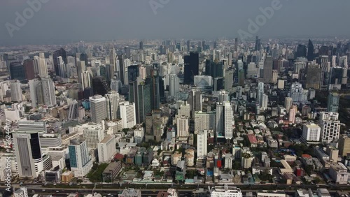 Aerial panoramic view of a big number of commercial and residential buildings in the densely populated capital Bangkok, Thailand. photo