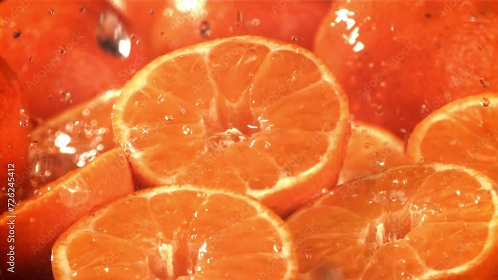 Raindrops drip on a fresh tangerine. Filmed on a high-speed camera at 1000 fps. High quality FullHD footage Raindrops drip on a fresh tangerine. Filmed on a high-speed camera at 1000 fps. High quality FullHD footage
