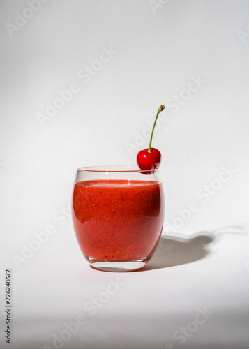 Wallpaper Mural Glass with strawberry, red smoothie and on a white background. There's a cherry on the glass. Summer drink. Vitamins, diet, proper nutrition, veganism Torontodigital.ca