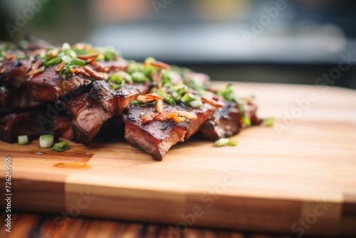 smoky ribs resting on a board