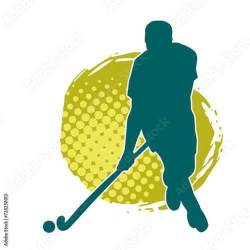 Silhouette of male field hockey athlete in action. Silhouette of a man playing field hockey sport.