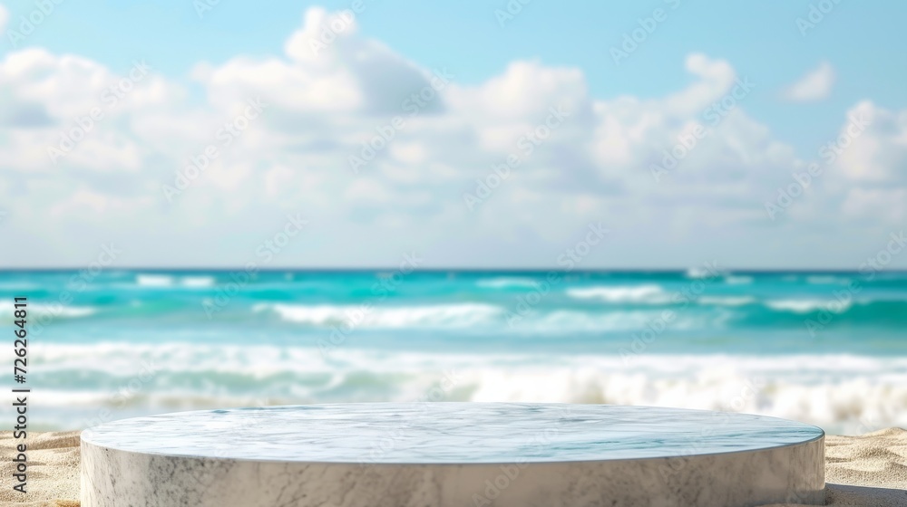 Tropical sandy beach with marble podium, ocean blur