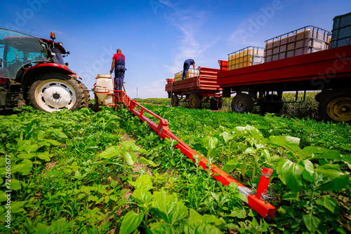 Tractor with sprayer came for reload, water, herbicide and pesticide