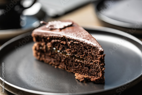 Photography Sacher cake with coffee on the table in the cafe.