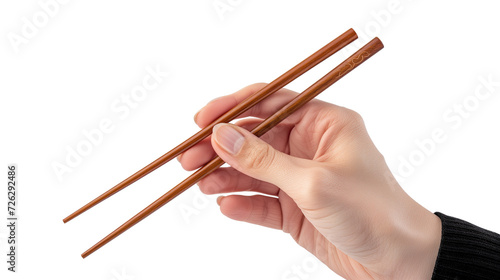 Asian male right hand holds wooden chopsticks isolated