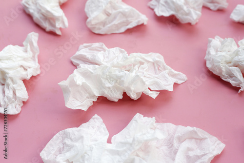Crumpled tissue paper. Facial tissue on pink background.