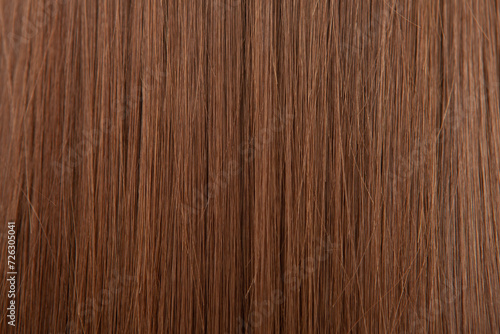 Close up of brown hair as background. Texture of natural hair..