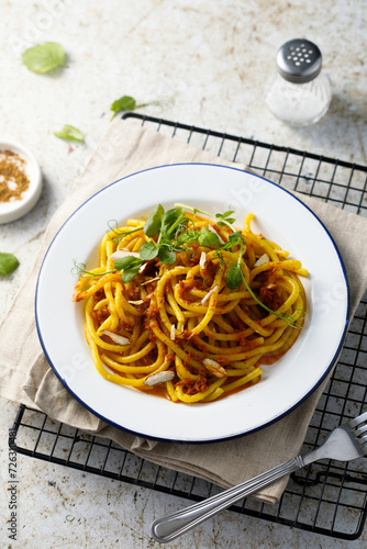 Pasta with red pesto and almond