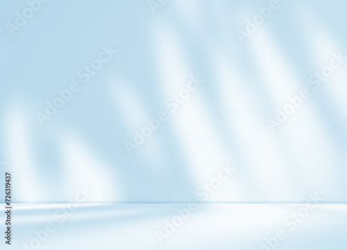 Empty blue pastel room studio with leaves shadow effect overlay. Interior design background for product presentation display. Cosmetic showroom. Minimal Mock up design. Winter colour backdrop. 